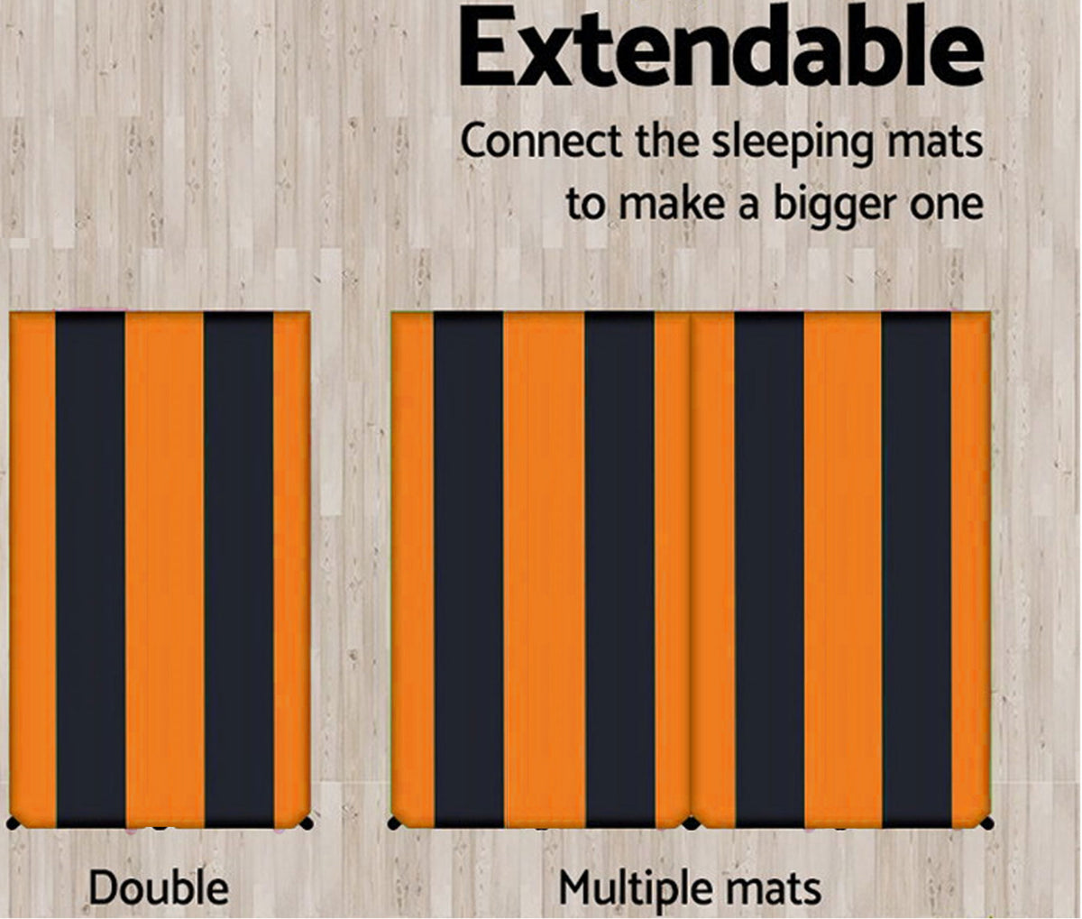 Extendable sleeping mats with orange and black stripes on a wooden background