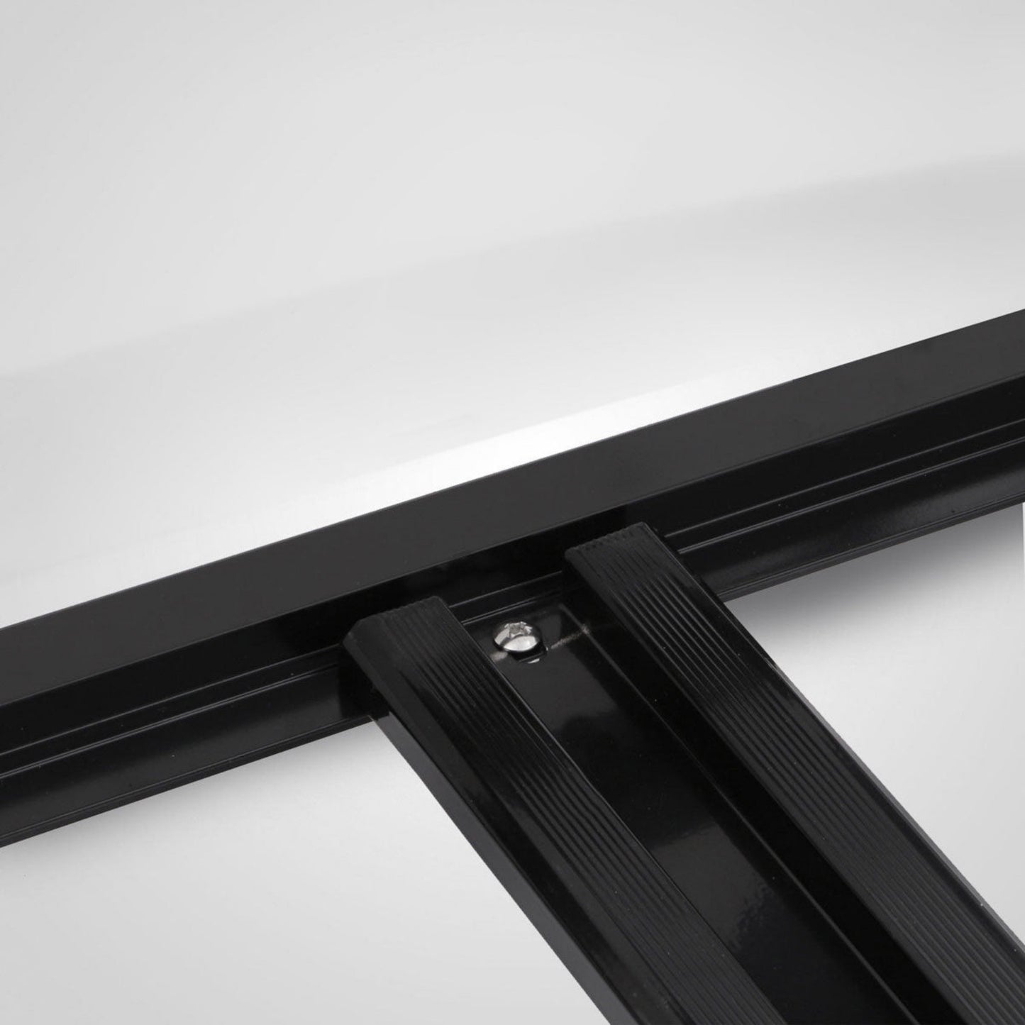 Close-up of a black metal frame on a white background