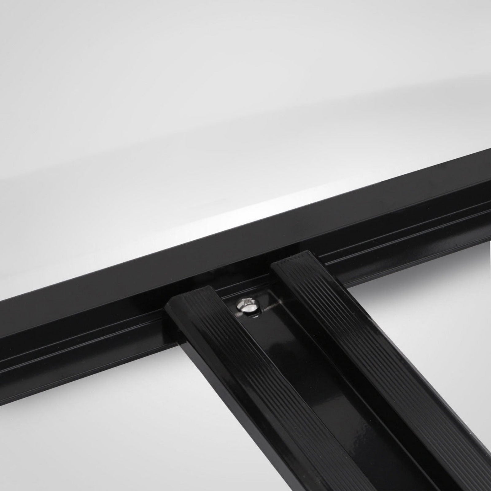 Close-up of a black metal frame on a white background